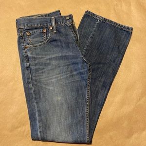 Levi 527 distressed jeans.
